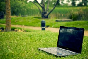 a laptop on the grass