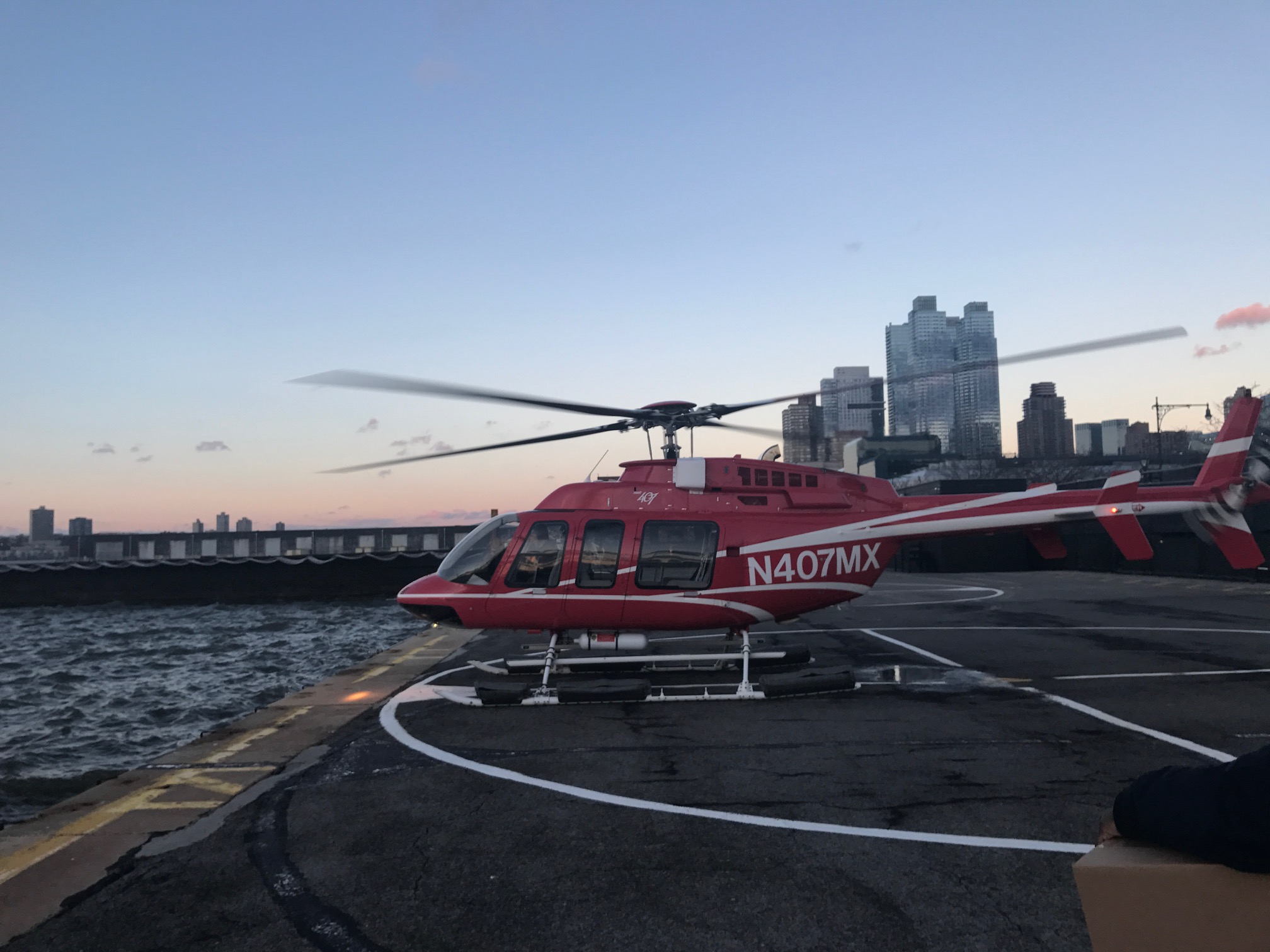 a red helicopter on a dock