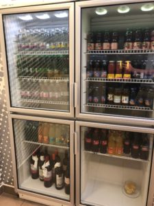 a refrigerator with bottles of liquid